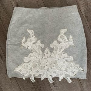 Unique gray mini skirt with white lace